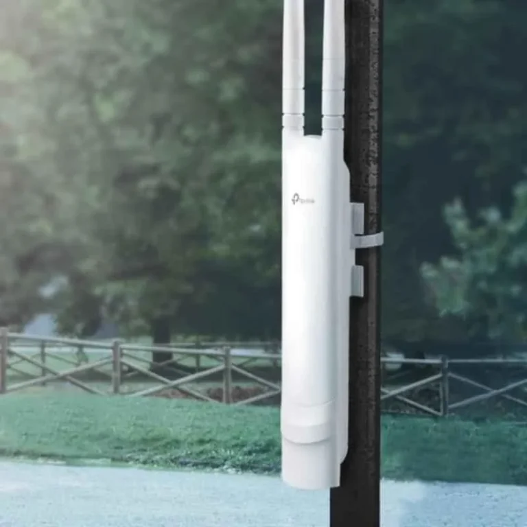 TP-Link Omada EAP110-Outdoor Access Point with 5dBi antennas for 300Mbps WiFi, mounted on a pole in an outdoor setting.
